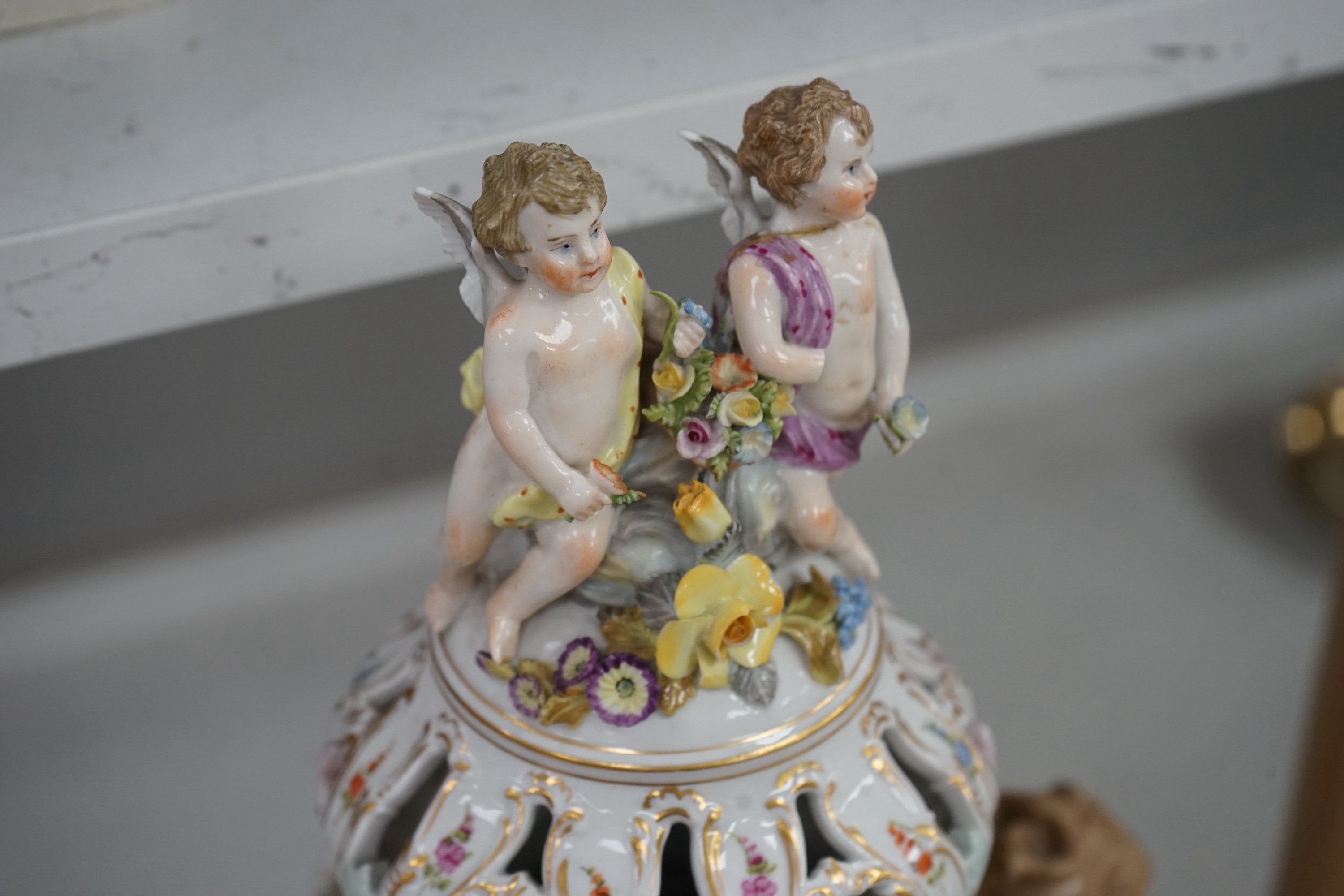 A Dresden floral encrusted porcelain incense burner hand painted with figures annd flowers, together with a similar lidded box, largest 52cm high. Condition - some losses